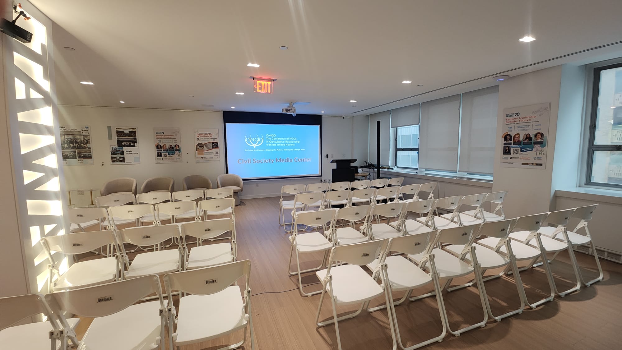 Full seating layout facing the projection screen displaying the CoNGO Civil Society Media Center slide